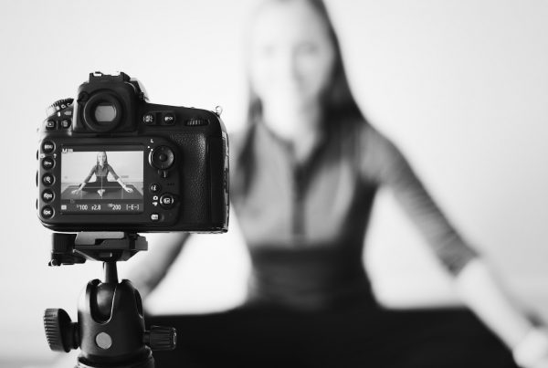 Blogger recording a video with a camera influencer marketing