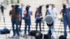 evolve & co public relations public speech microphone press media publicity people outside