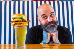 Jesse Kage looking at the Kage burger at the Boulevard Burgers and Taphouse